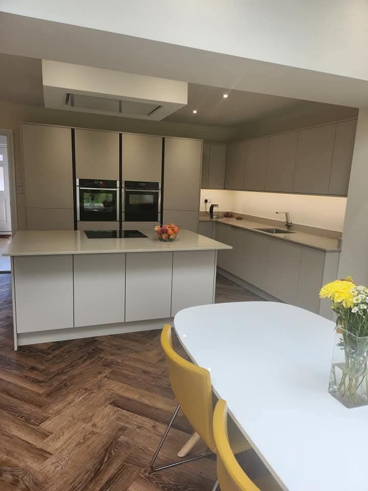 Modern bespoke kitchen with dark fitted cabinets, Greater Manchester